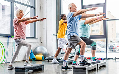 A group of older adults in a group fitness class