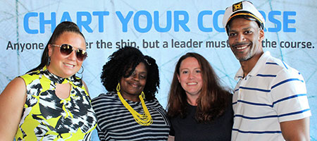 Group of YMCA professionals wearing captain's hats in photo booth at the YPN Chapter 25 Spring Conference.