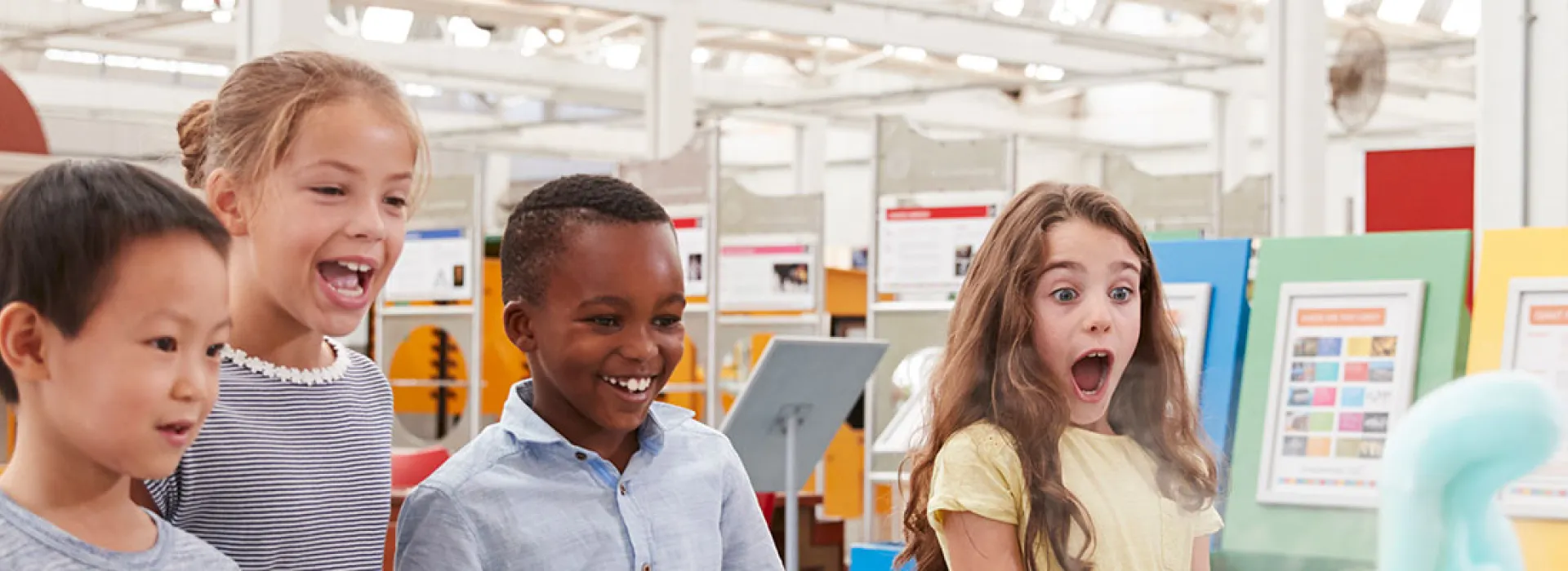A group of kids surprised and delighted by a science experiment